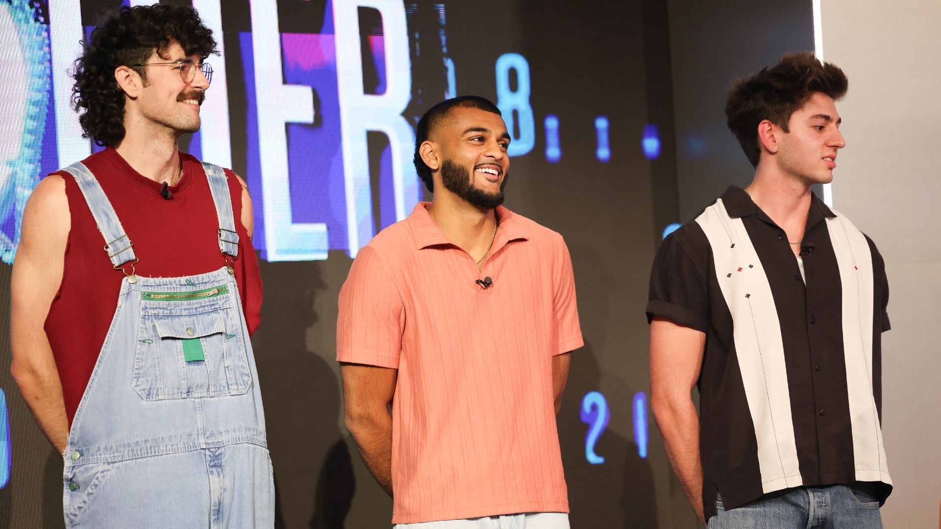 Barrett Pfeiffer, Yash Patel, and Drew Campbell standing together on the Big Brother 28 stage