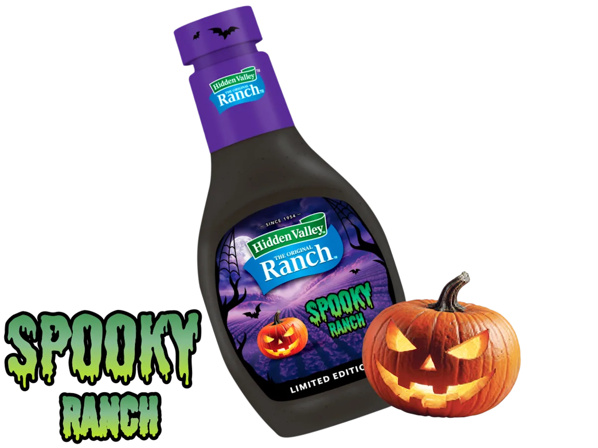 A bottle of Hidden Valley Spooky Ranch beside a carved jack-o’-lantern on a purple Halloween background