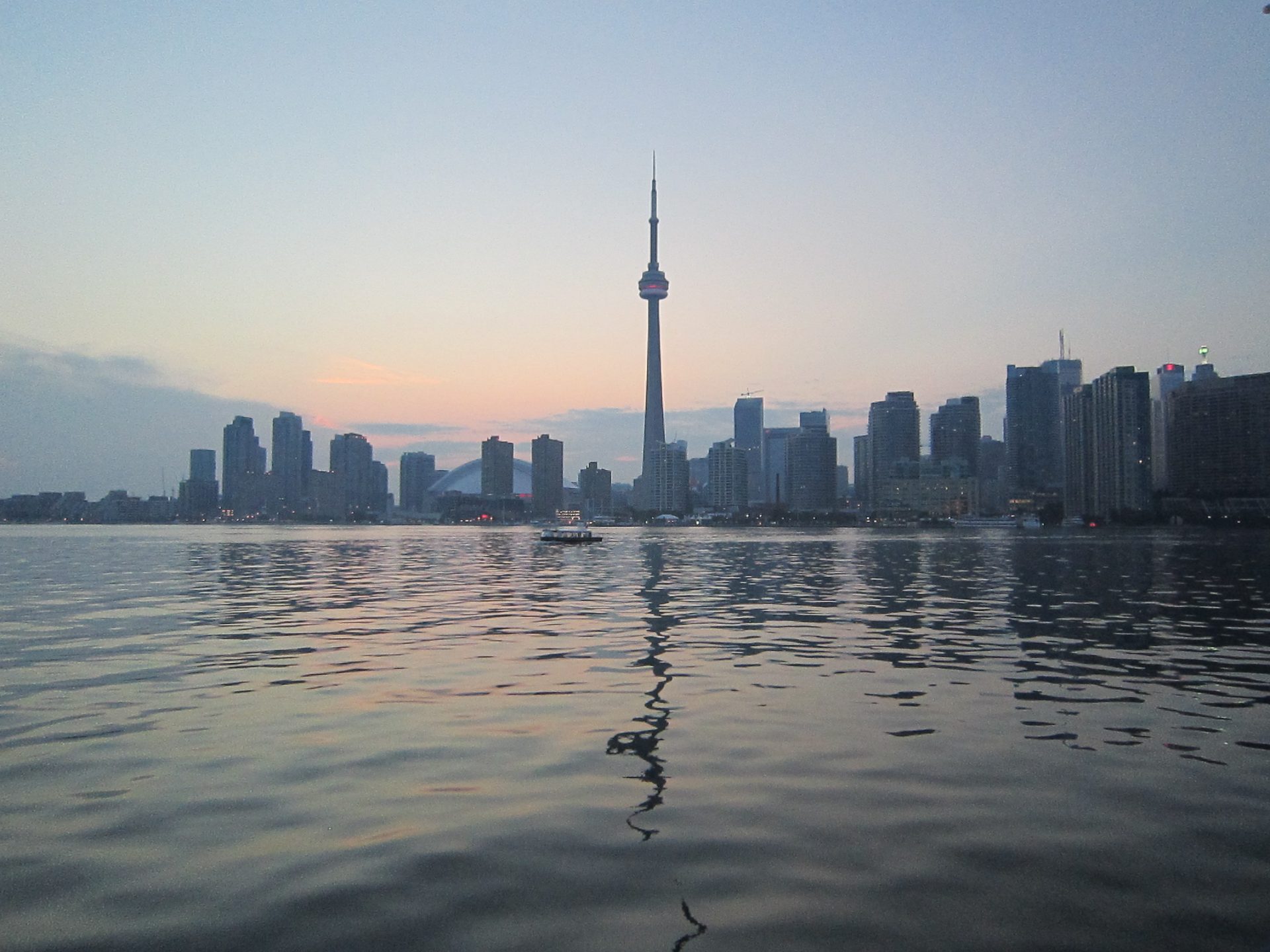 Lake Ontario stretching toward the horizon under a blue sky