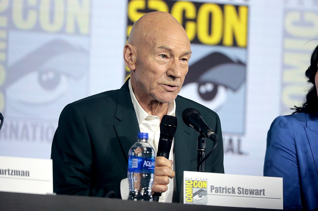 Patrick Stewart speaking into a microphone at the 2019 San Diego Comic-Con.